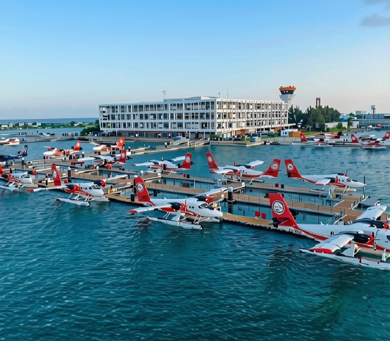 Seaplanes docked at a Maldives seaplane terminal platform